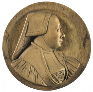This boxwood medallion is of an elderly woman, in profile to the right, wearing a folded linen cap with no hair visible, a laced bodice and gathered sleeves. The medallion is 1½ in (3.8 cm) in diameter and was carved in Germany in 1530.